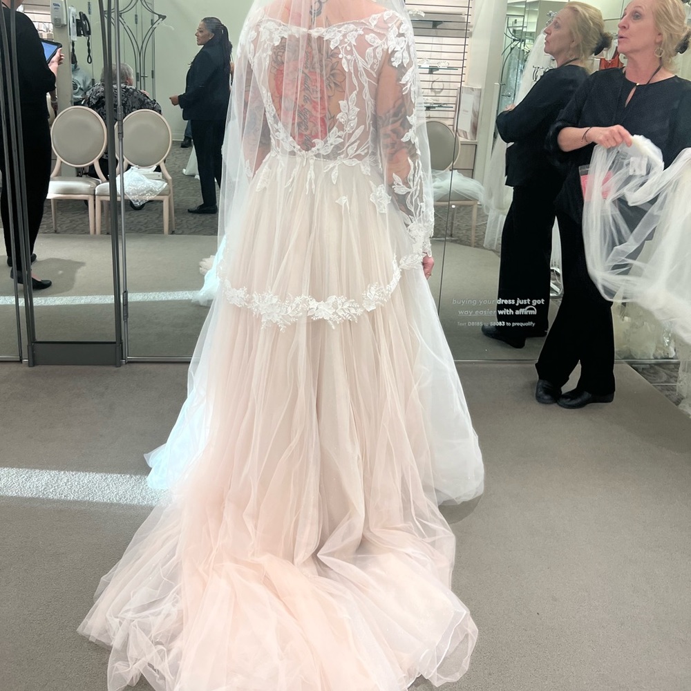 Wedding dress and Veil. Both in pictures. Worn one time no stains and rips.